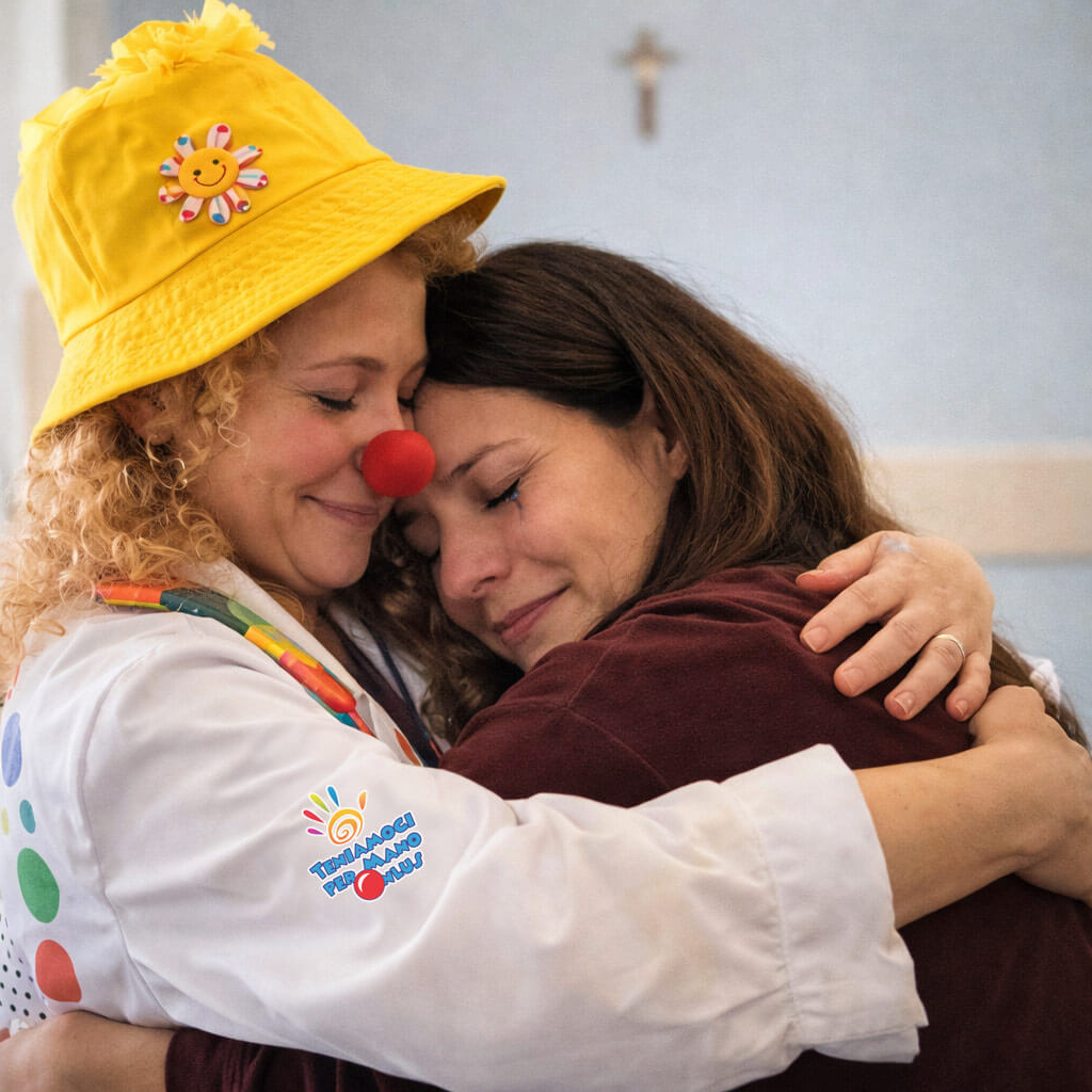 Un abbraccio a una mamma